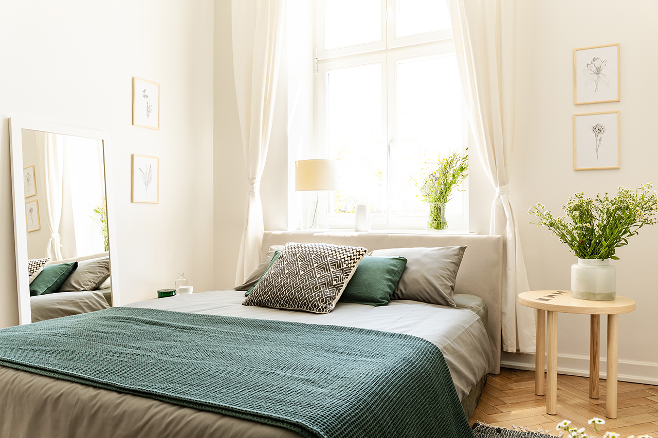 Eco-cotton-linen-and-blanket-on-a-bed-in-nature-loving-family-guesthouse-for-spring-and-summer-vacation.